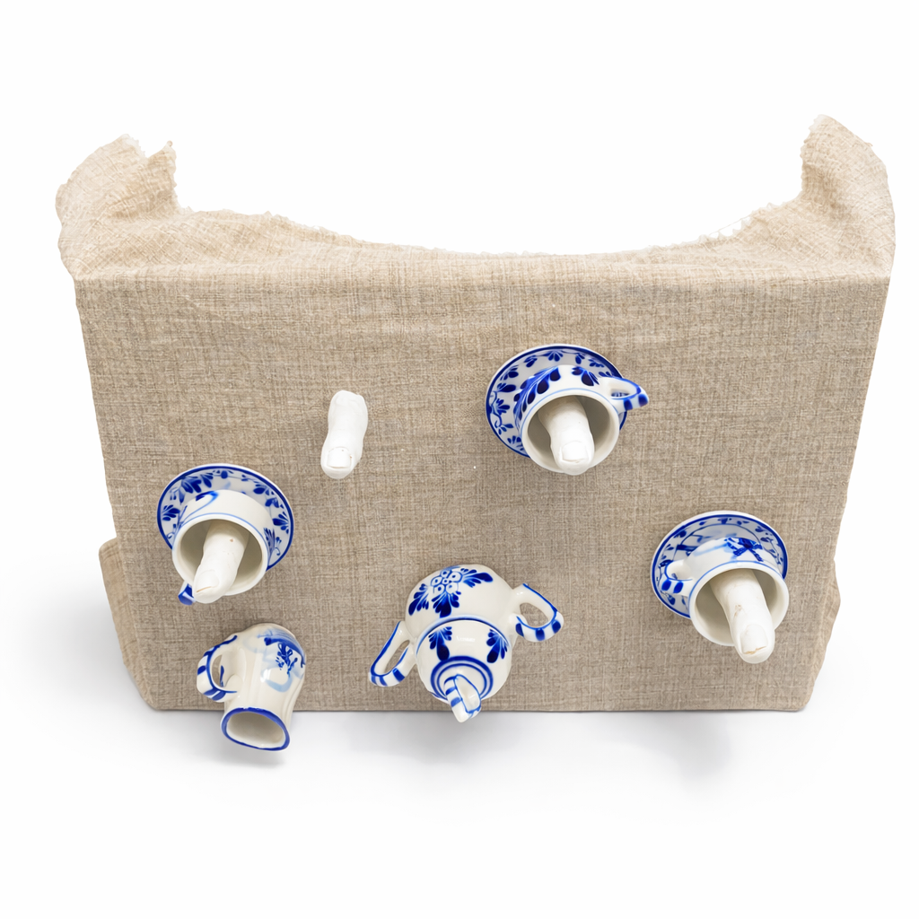 Object with cermics, gips, wood, fabric by Sylwia Zawiślak